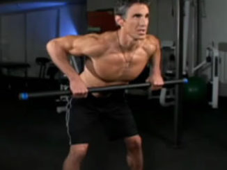 Man performing bent over barbell rows