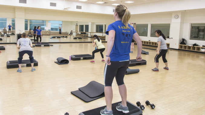 Fitness group working out using interval training